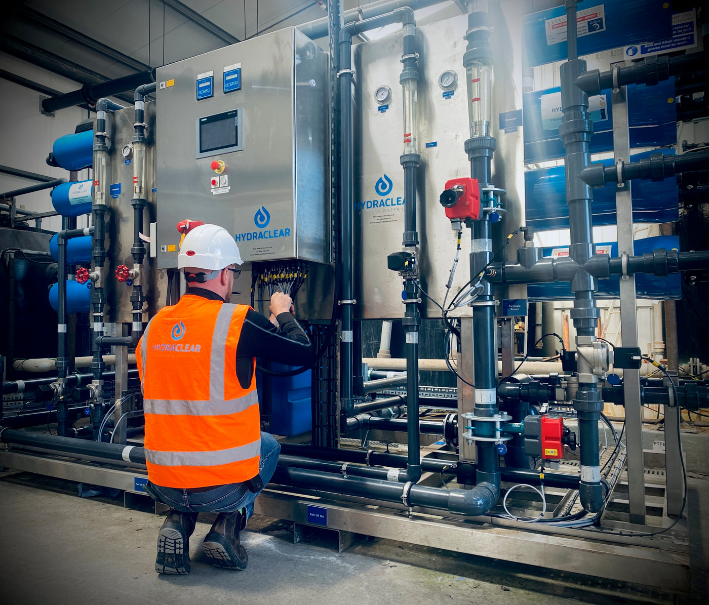 Hydra-Clear engineer servicing industrial water treatment equipment
